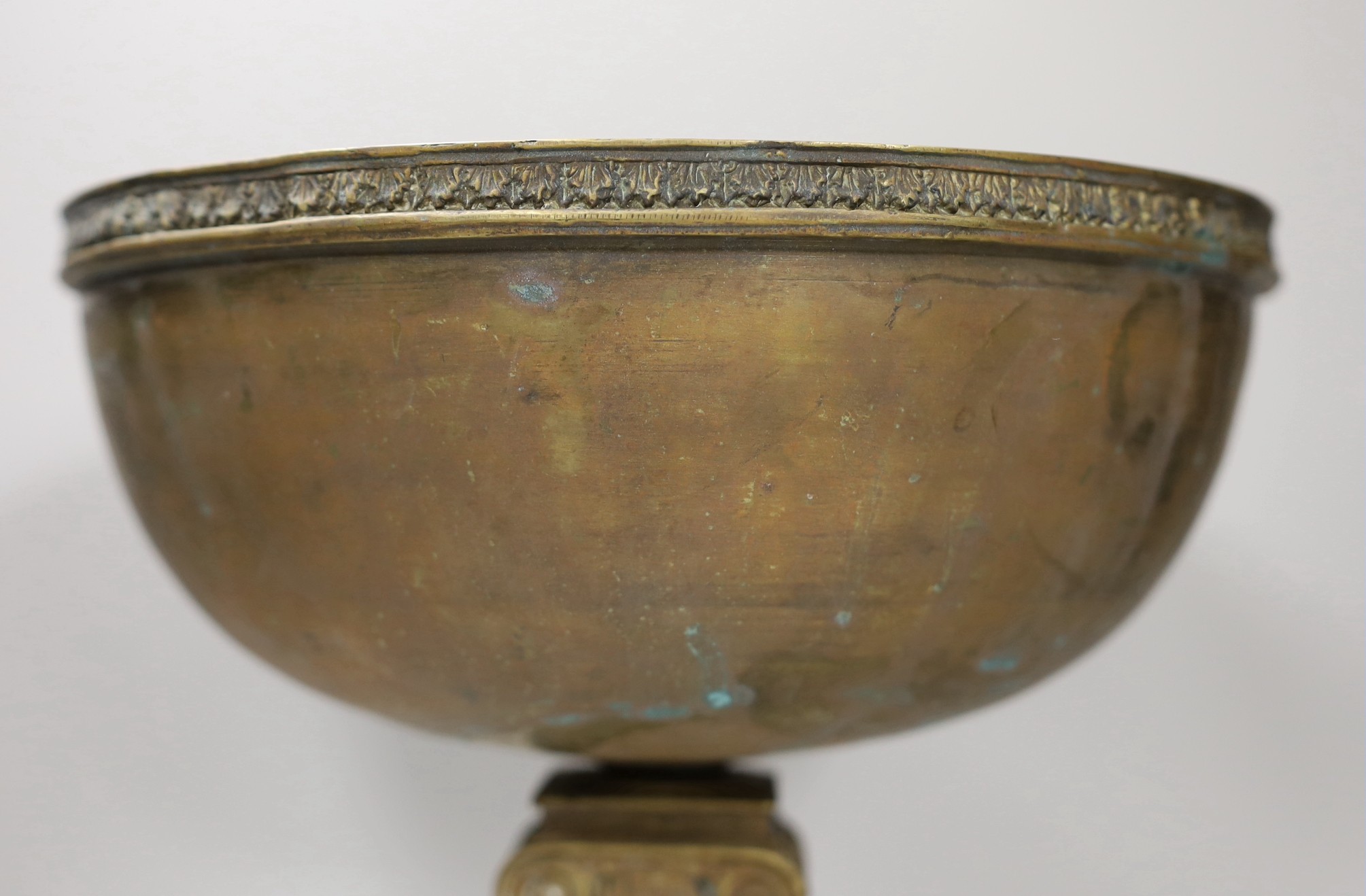 A brass bowl with Ionic column stand, 30cm high